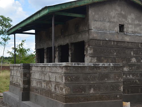 Ongoing construction of a block 8 door pit latrine at Gikuru Primary School..